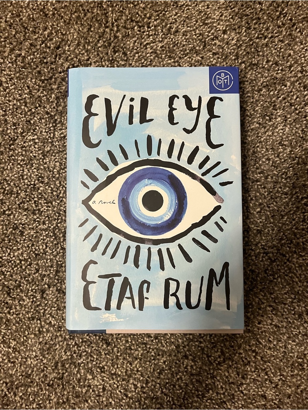 Evil Eye Novel with Blue Eye Graphic Cover
